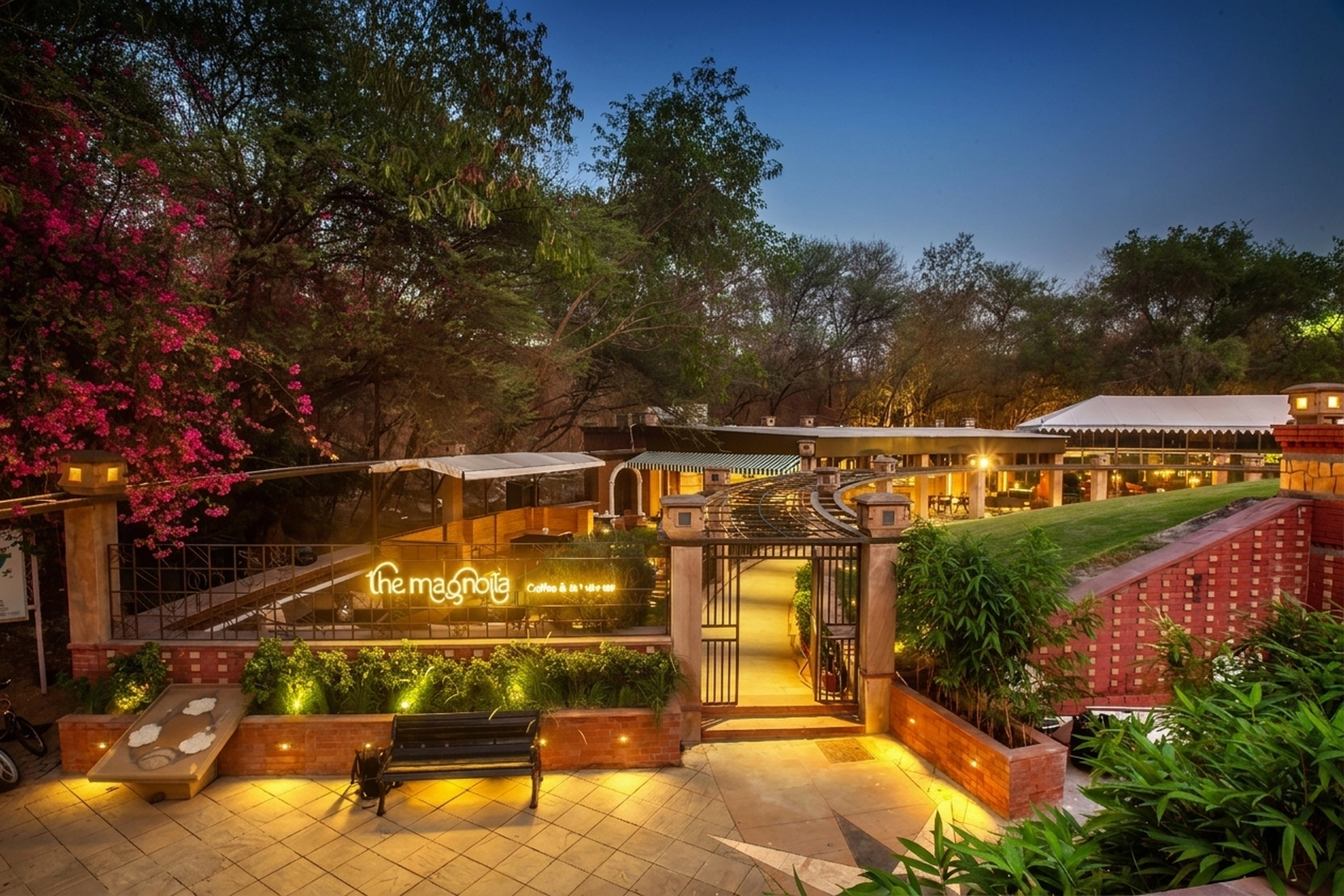 The Magnolia entrance courtyard and illuminated gardens